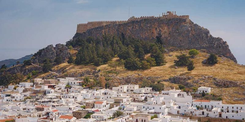 Visit Lindos and its beautiful alleys.